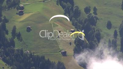 paraglider overtakes another
