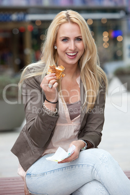 Beautiful girl having a burger