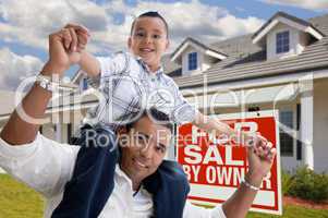 Hispanic Father and Son with For Sale By Owner Sign