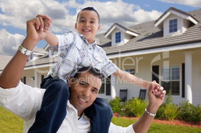Hispanic Father and Son in Front of House