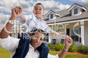 Hispanic Father and Son in Front of House