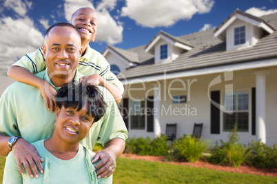 Attractive African American Family in Front of Home