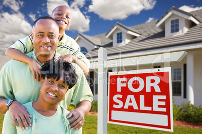 African American Family with For Sale Sign and House