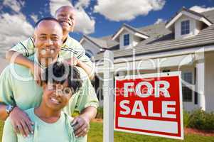African American Family with For Sale Sign and House