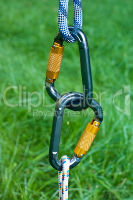 carabiners on a green grass background