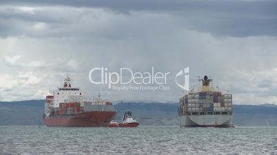 Two container ships pass