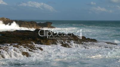 Sea waves against rocks on coast