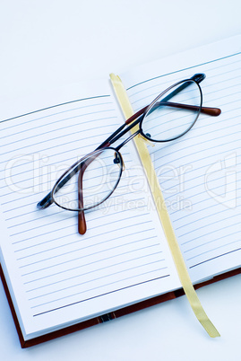 Glasses on the notebook