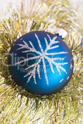 Blue christmas ball on the shiny decoration