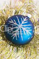 Blue christmas ball on the shiny decoration