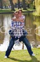 Young couple doing piggyback ride