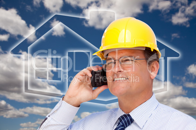 Contractor in Hardhat on Phone Over House Icon and Blurry Clouds