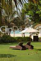 Luxurious hotel recreation area with modern deck chairs, Dubai,