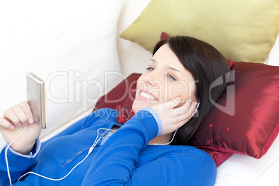 Happy woman listening music with headphones