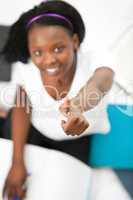 Cheerful teen girl with a thumb up studying