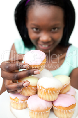 Young woman holding a cake