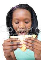 Afro-american young woman eating a sandwich