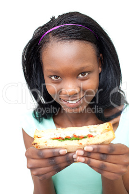 Cheerful young woman eating a sandwich