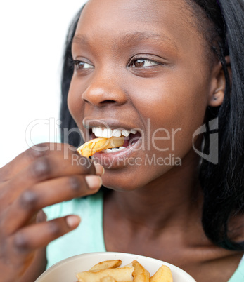 Jolly young woman eating fries