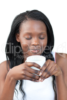 Delighted woman drinking a coffee