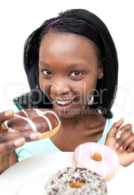Attractive young woman eating a chocolate donut