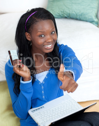 Cheerful woman shopping on-line