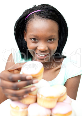 Attractive young woman taking a cake