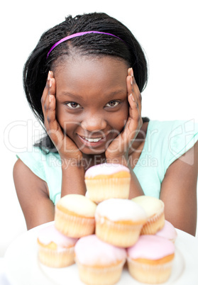 Cheerful young woman looking at cakes