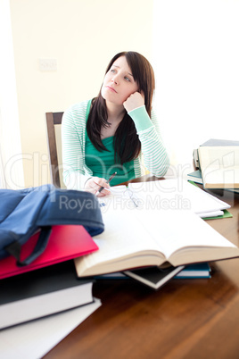 Charming teen girl studying