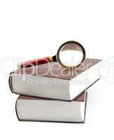 Magnifying glass on books.