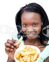 Charming young woman eating fries