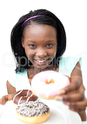 Pretty young woman holding a donut