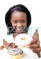 Pretty young woman holding a donut