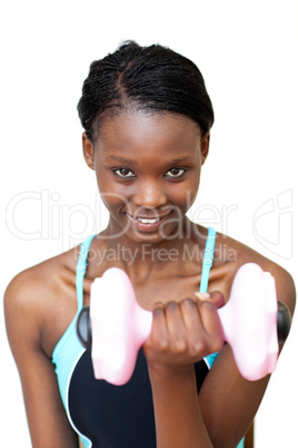 Smiling woman working out with dumbbell