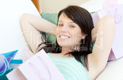 Charming woman relaxing after shopping