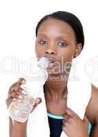 Beautiful fitness woman drinking water