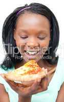 Jolly young woman eating a pizza