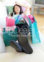 Exhausted woman relaxing after shopping