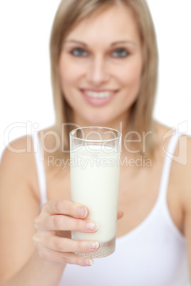 Blond woman holding a glass of milk