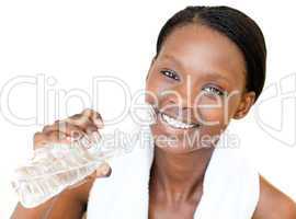 Happy fitness woman drinking water