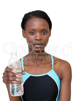 Serious woman holding a bottle of water
