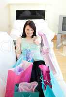 Cheerful woman relaxing after shopping
