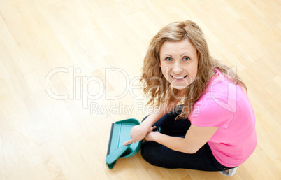 Happy young woman doing housework