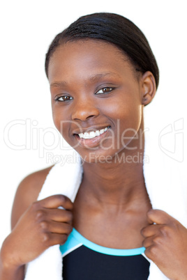 Smiling fitness woman with a towel around her neck