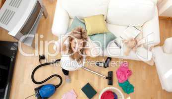 Frustrated blond woman vacuuming the living-room