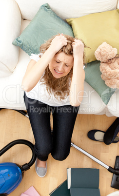 Depressed young woman doing housework