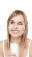 Delighted woman holding a glass of milk