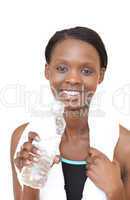 Jolly fitness woman drinking water