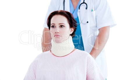 Portrait of an upset woman with a neck brace sitting on a wheelc