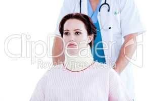 Portrait of an upset woman with a neck brace sitting on a wheelc